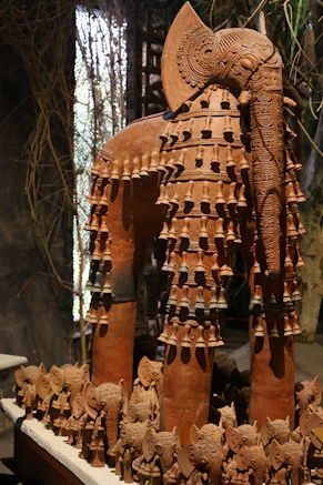 a statue of an elephant made of clay