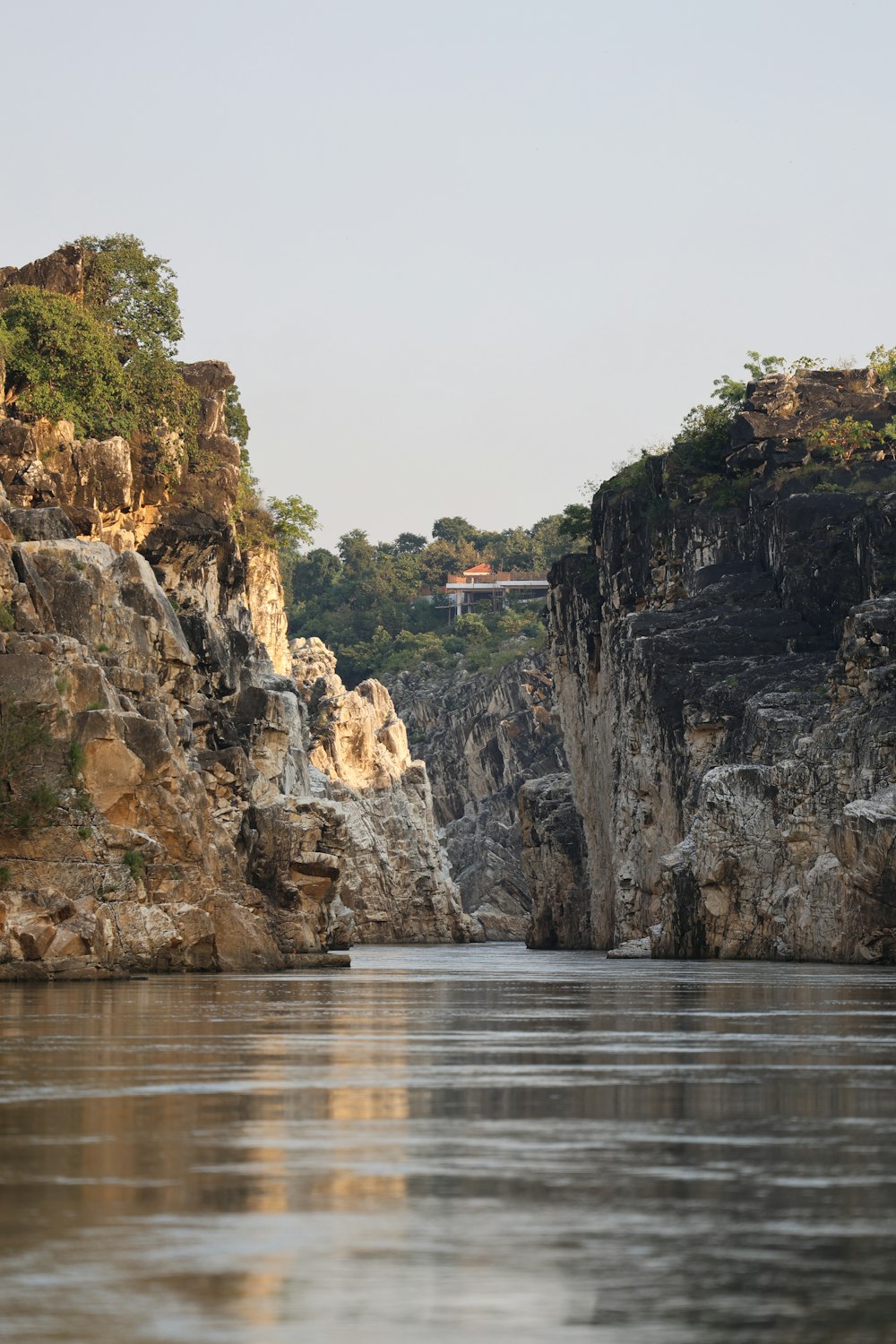 a large body of water surrounded by rocky cliffs