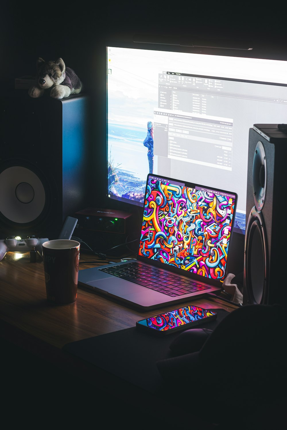 a laptop computer sitting on top of a wooden desk