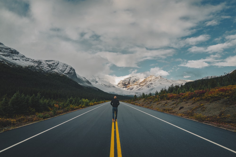 a person standing on the side of a road