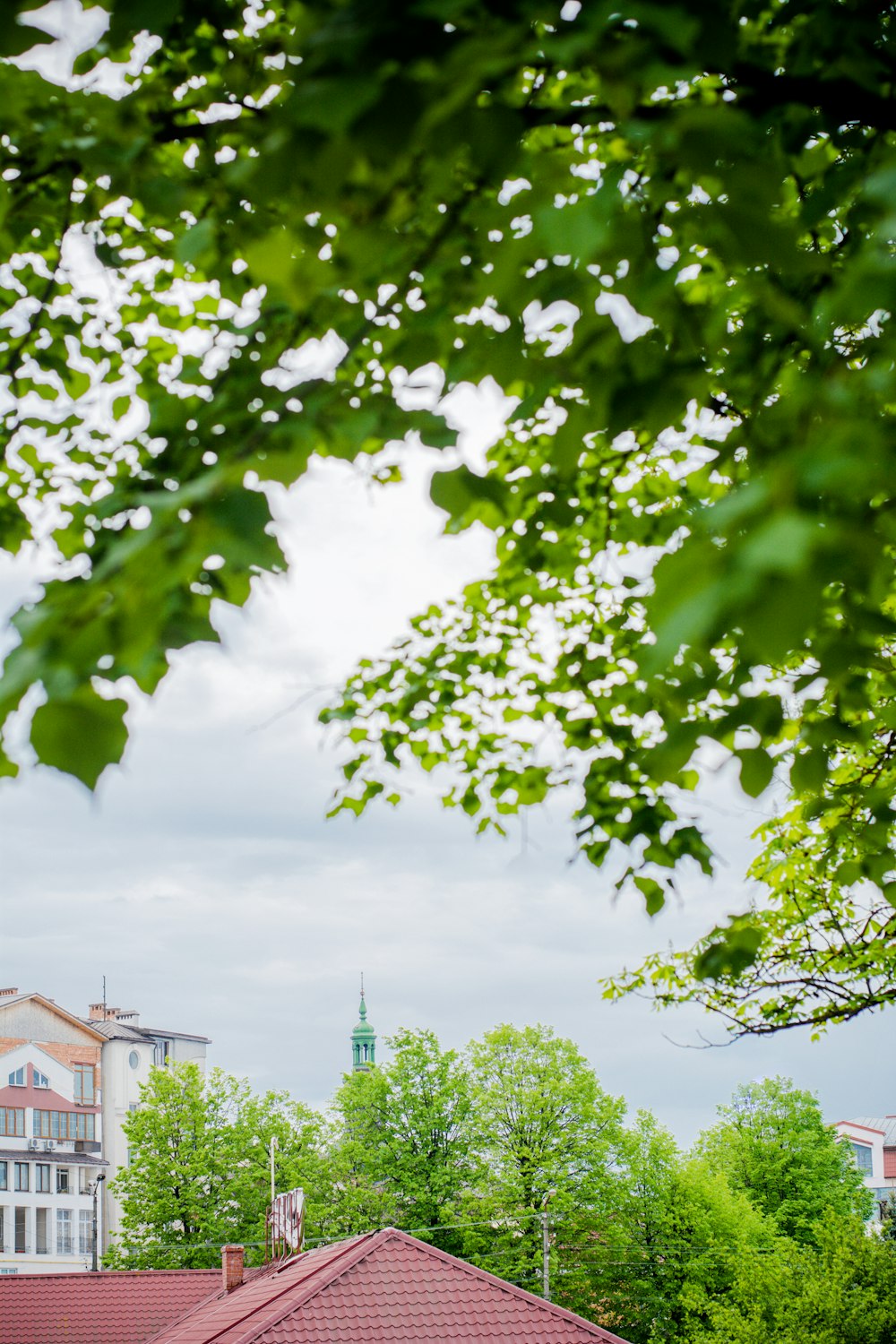 a view of a building with a clock tower in the background