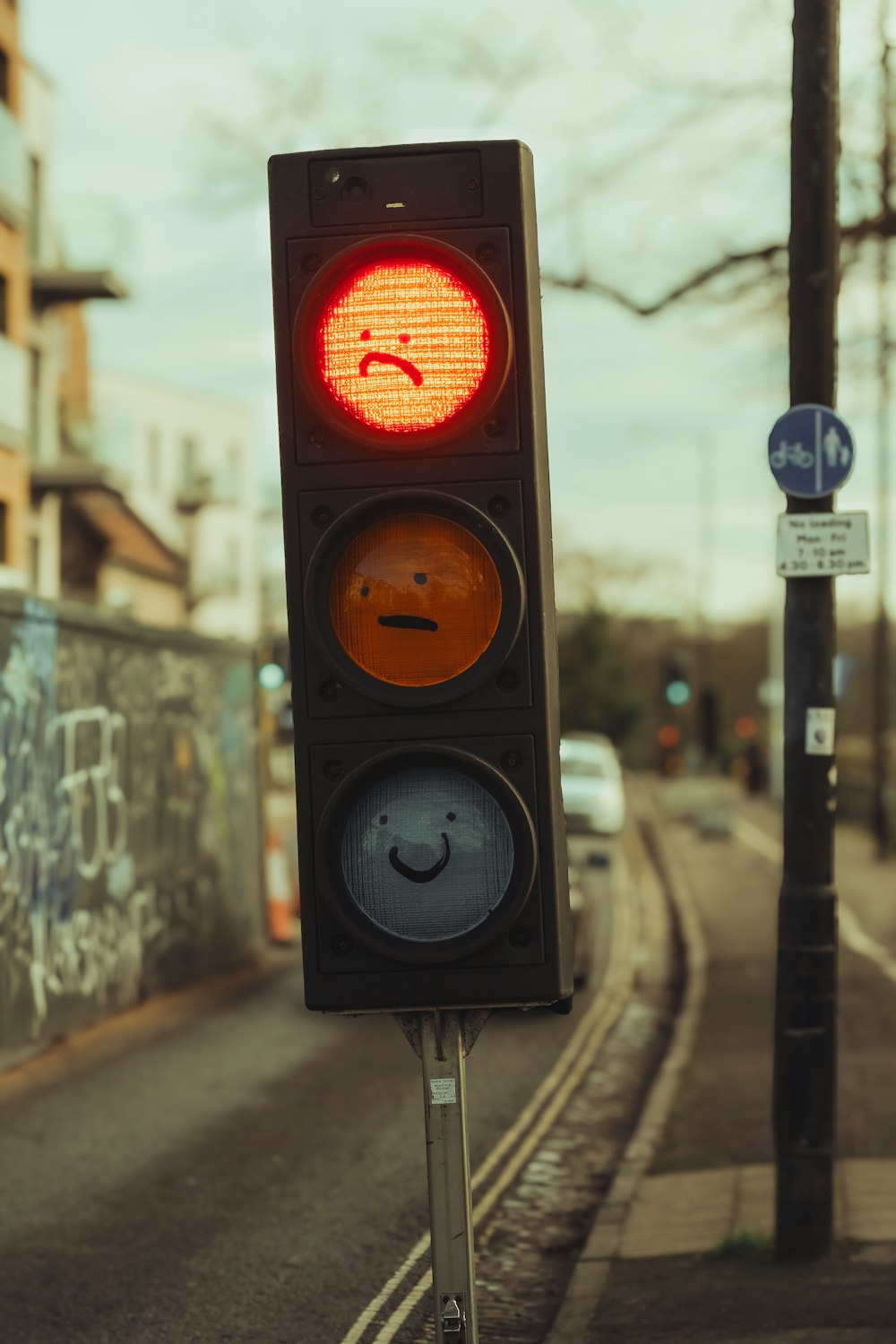 a traffic light with a smiley face drawn on it