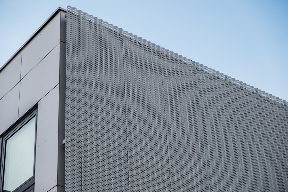 a close up of a building with a sky background