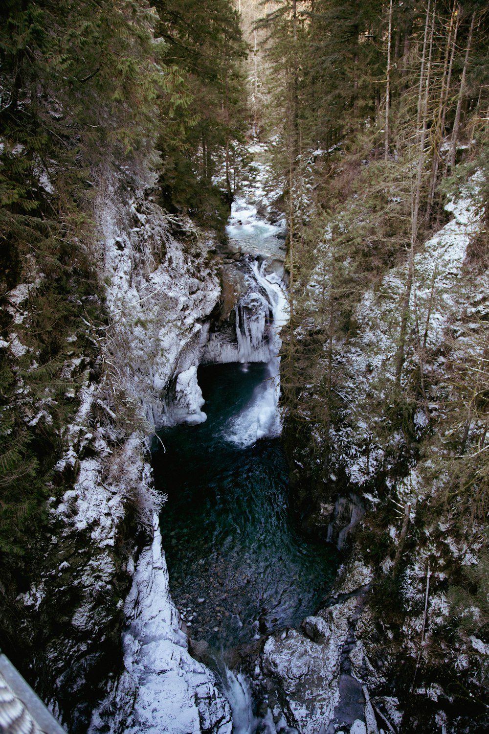 a river running through a snow covered forest