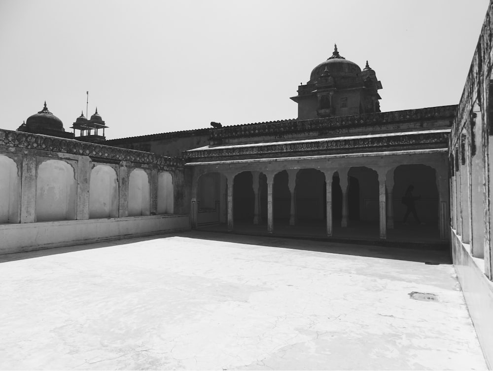 a black and white photo of a courtyard
