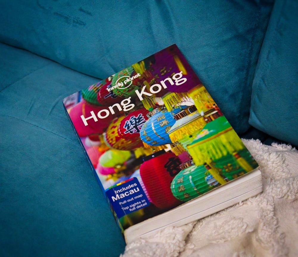 a book sitting on top of a blue couch