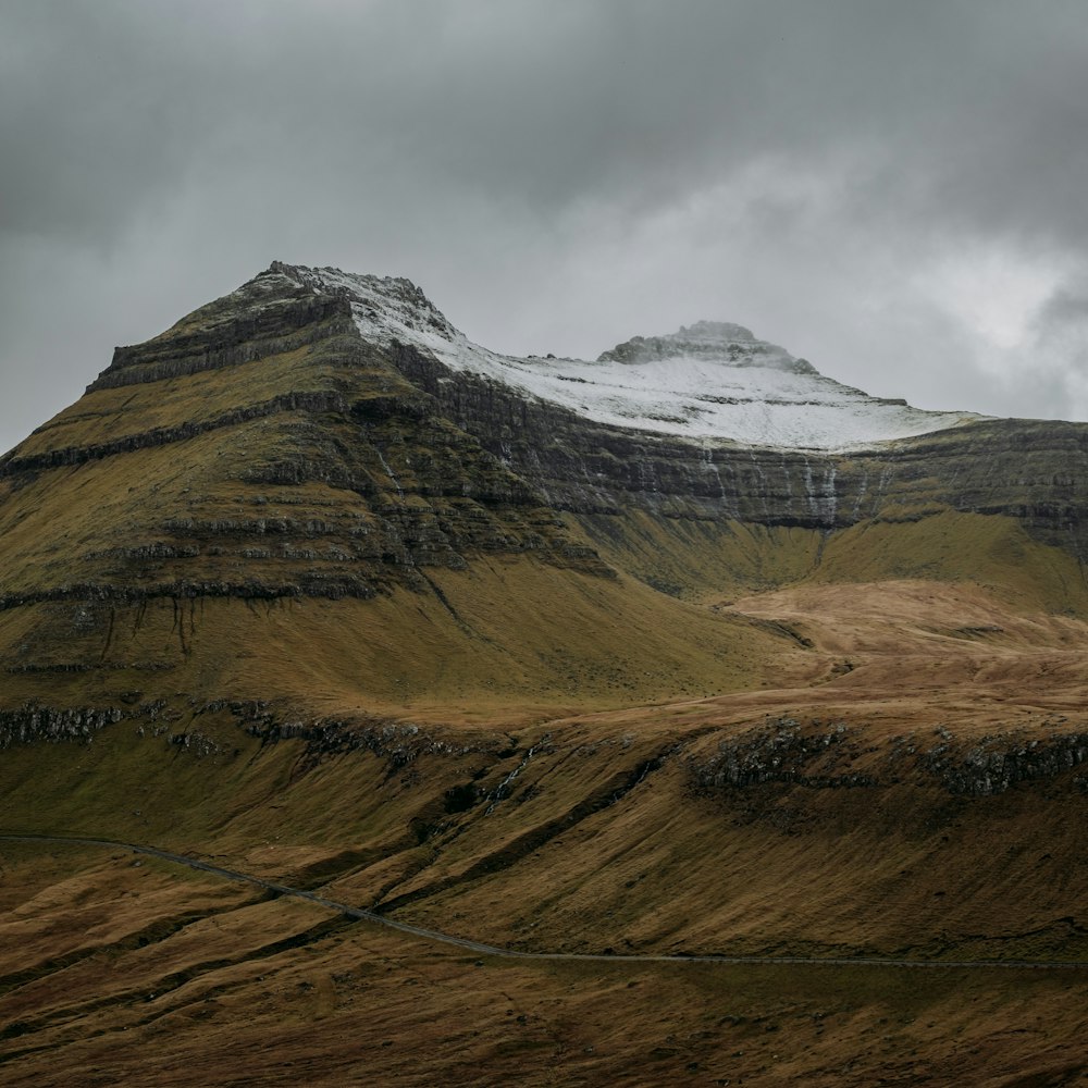 a very tall mountain with a snow covered top