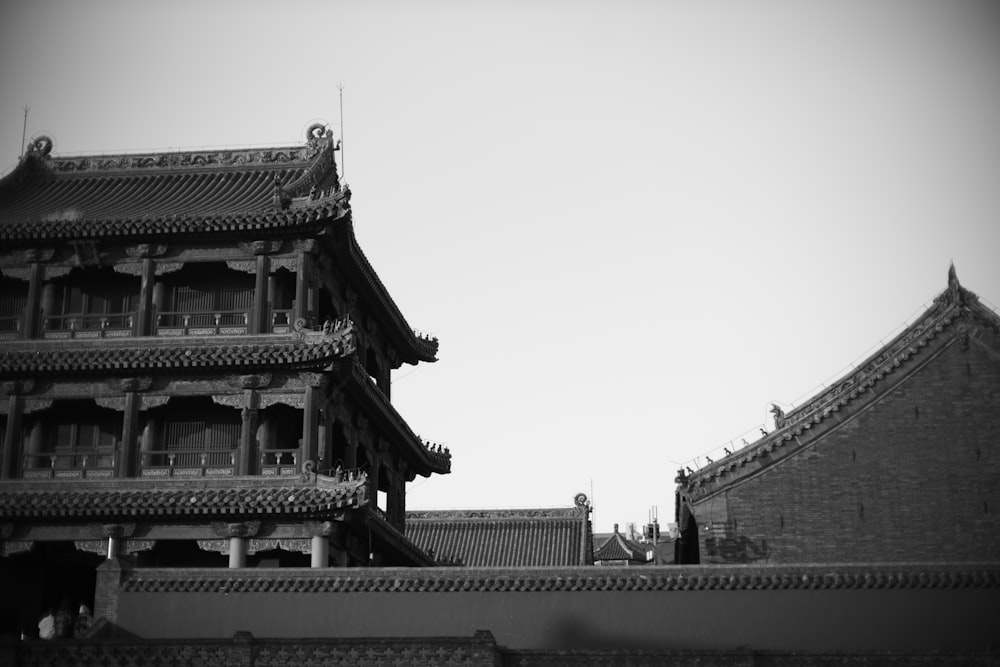 a black and white photo of a chinese building