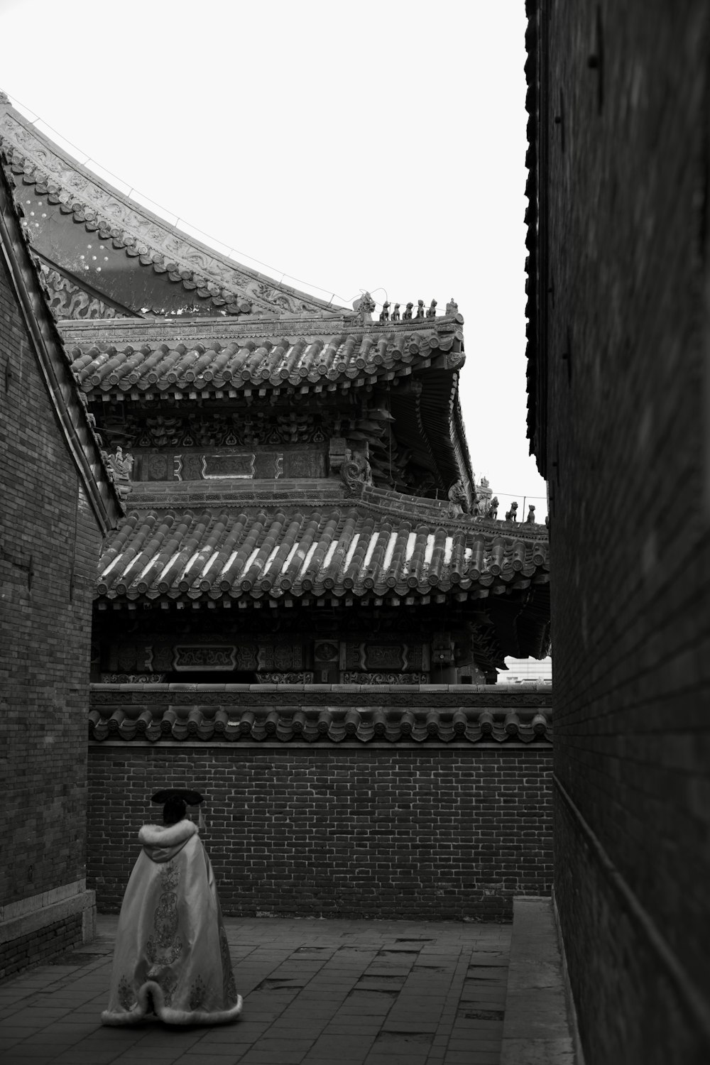 a black and white photo of a chinese building