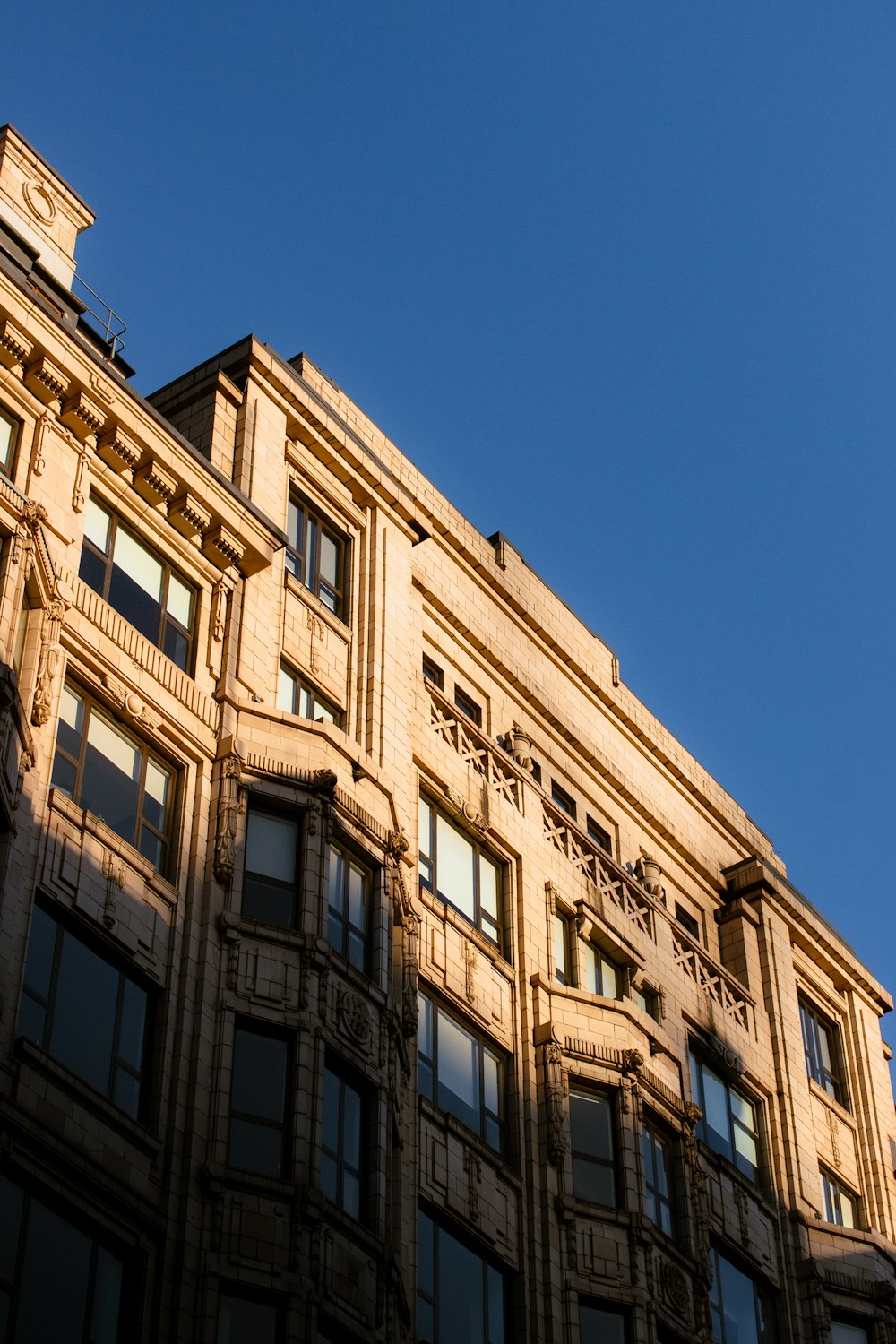 a tall building with a clock on the top of it