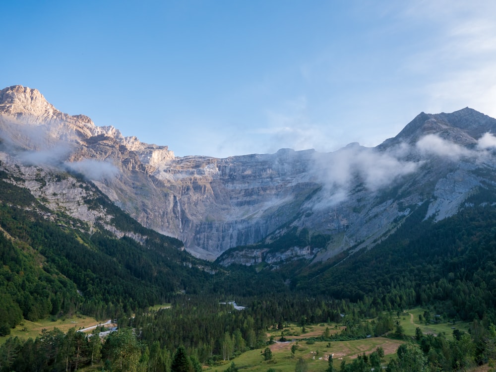 a mountain range with a valley in the foreground