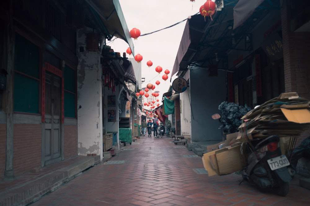 a street with a motorcycle parked on the side of it