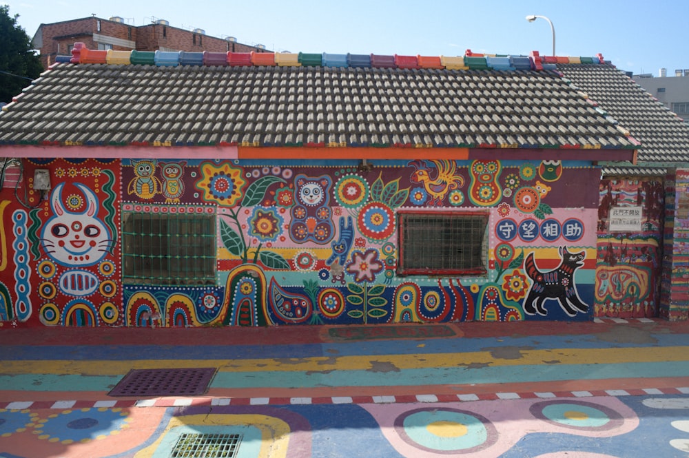 a colorful building with a cat painted on it