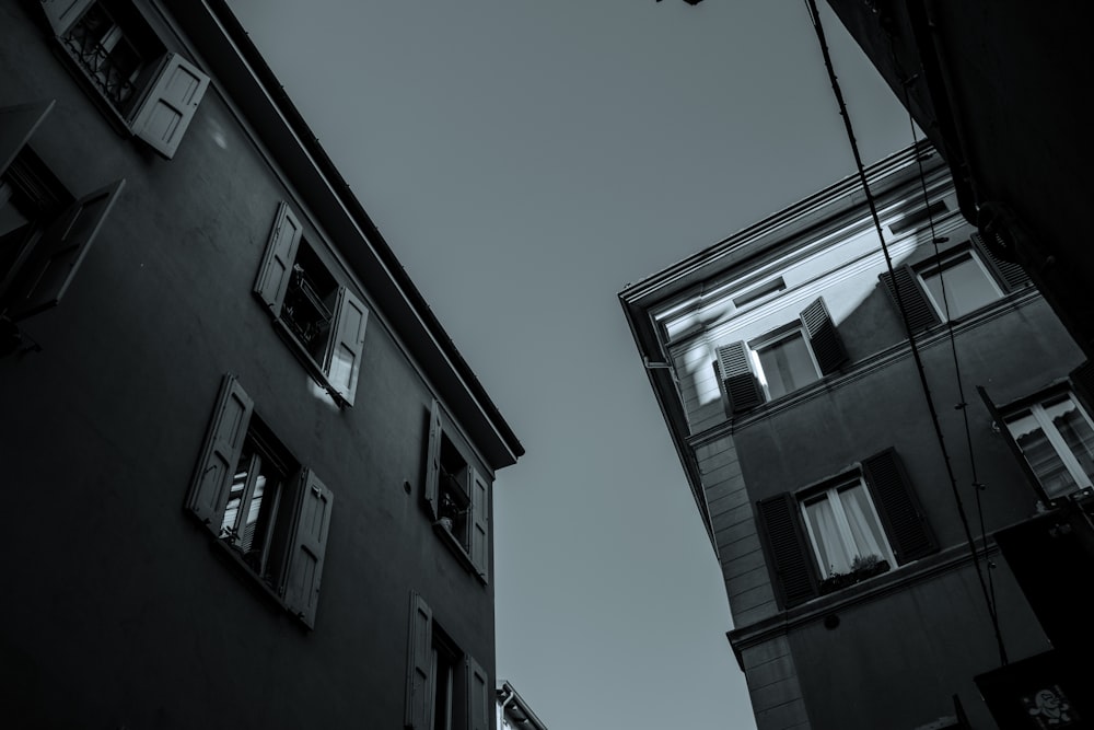 a black and white photo of a building and a street light