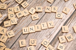 scrabble letters spelling out the word community