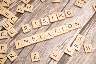 scrabble tiles spelling the word rising information