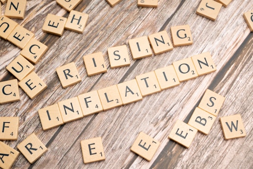 scrabble tiles spelling the word rising information