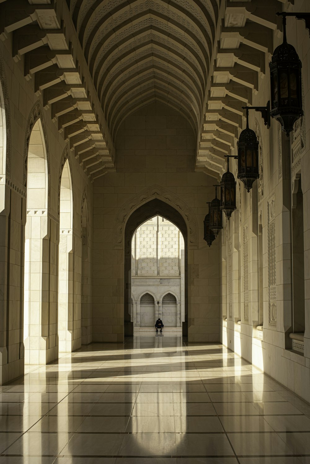 a long hallway with a clock on the wall