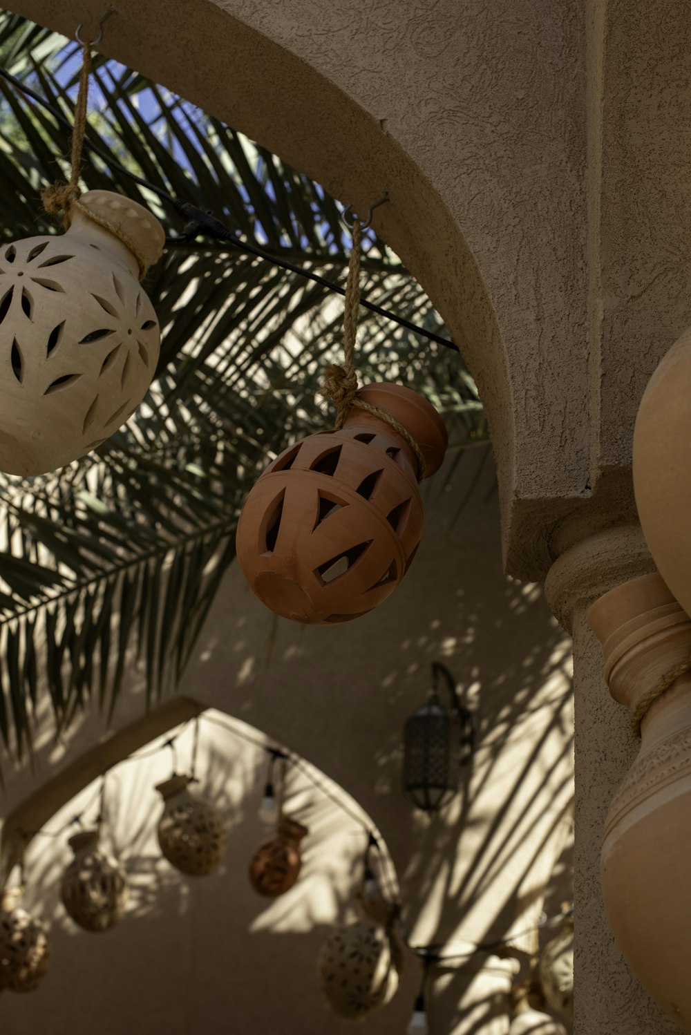 a bunch of ornaments hanging from the ceiling of a building