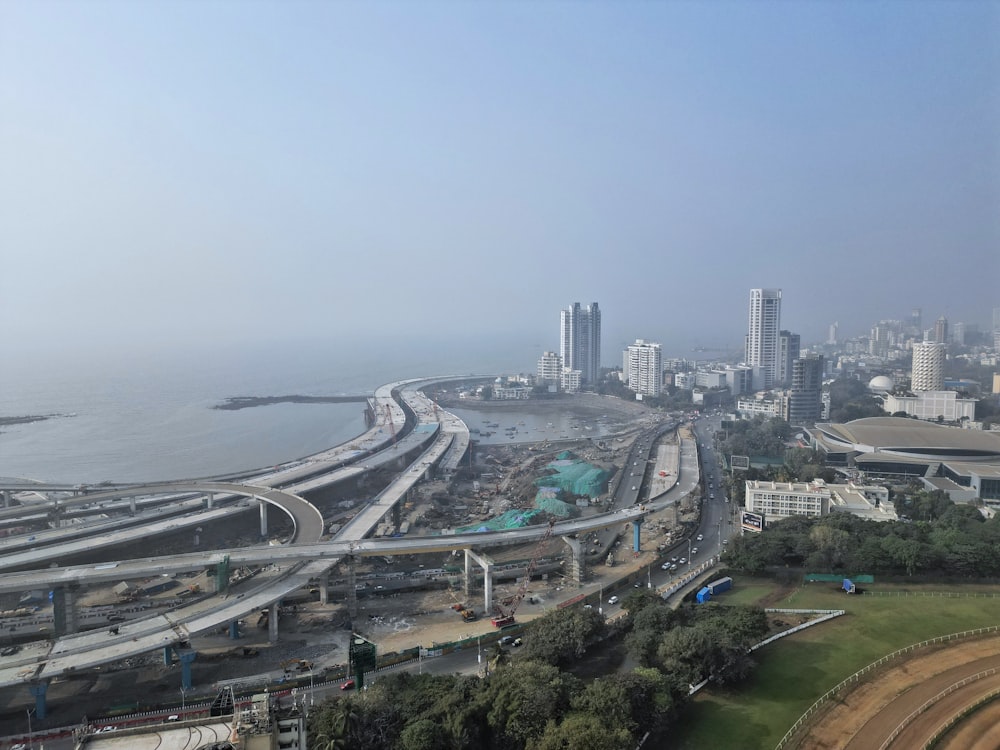 an aerial view of a highway and a city