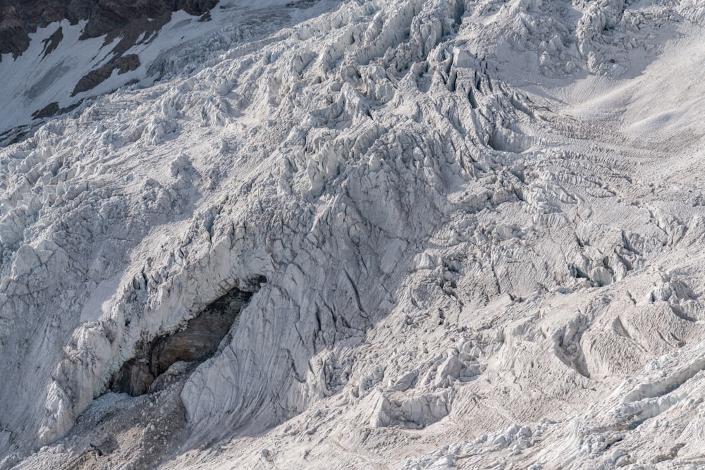 a man is skiing down a snowy mountain