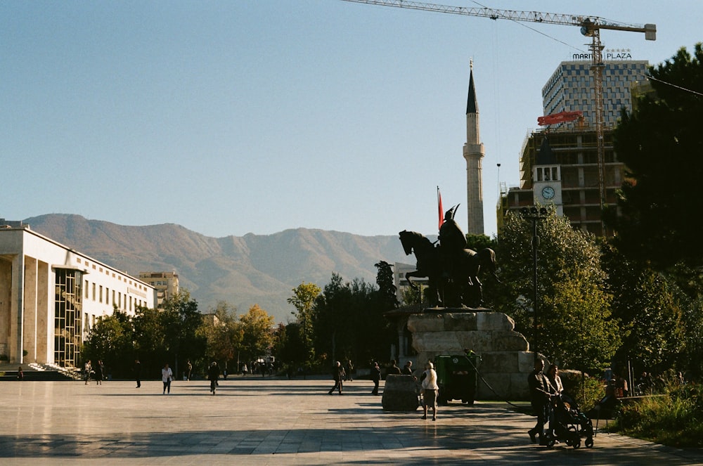 a statue of a man on a horse in the middle of a street