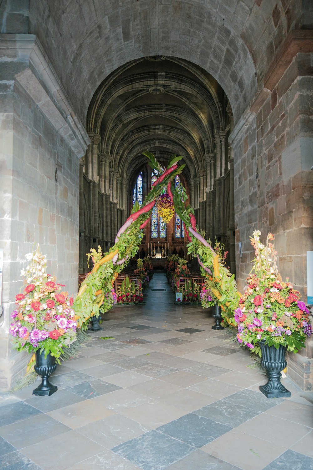 a hallway with a bunch of flowers in it