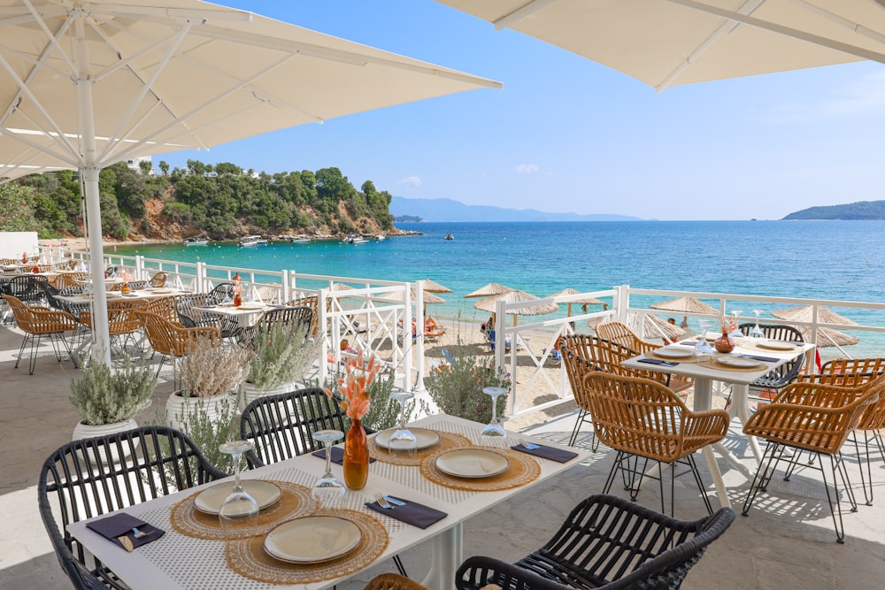 an outdoor dining area overlooking the ocean