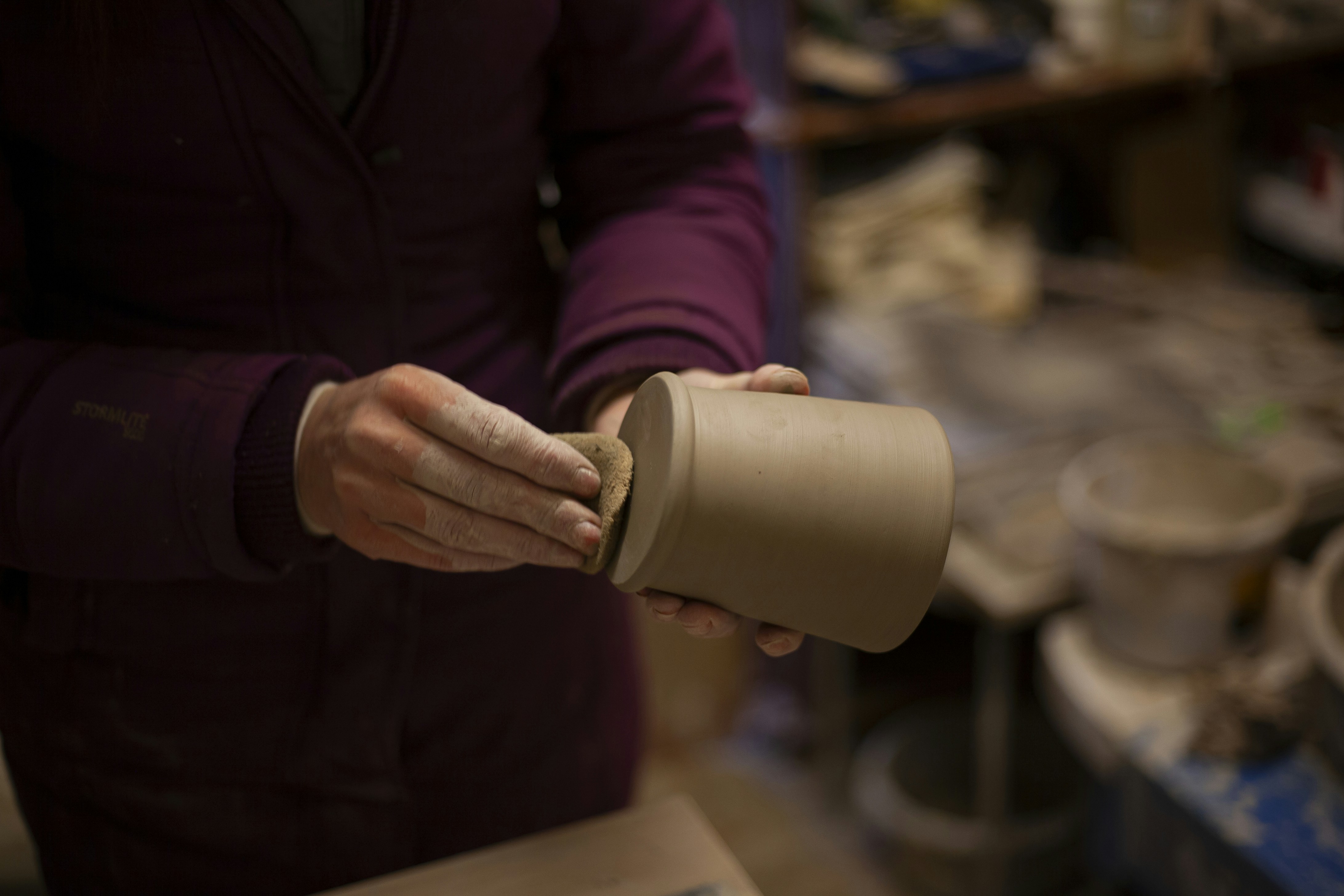 a person holding a cup in their hands