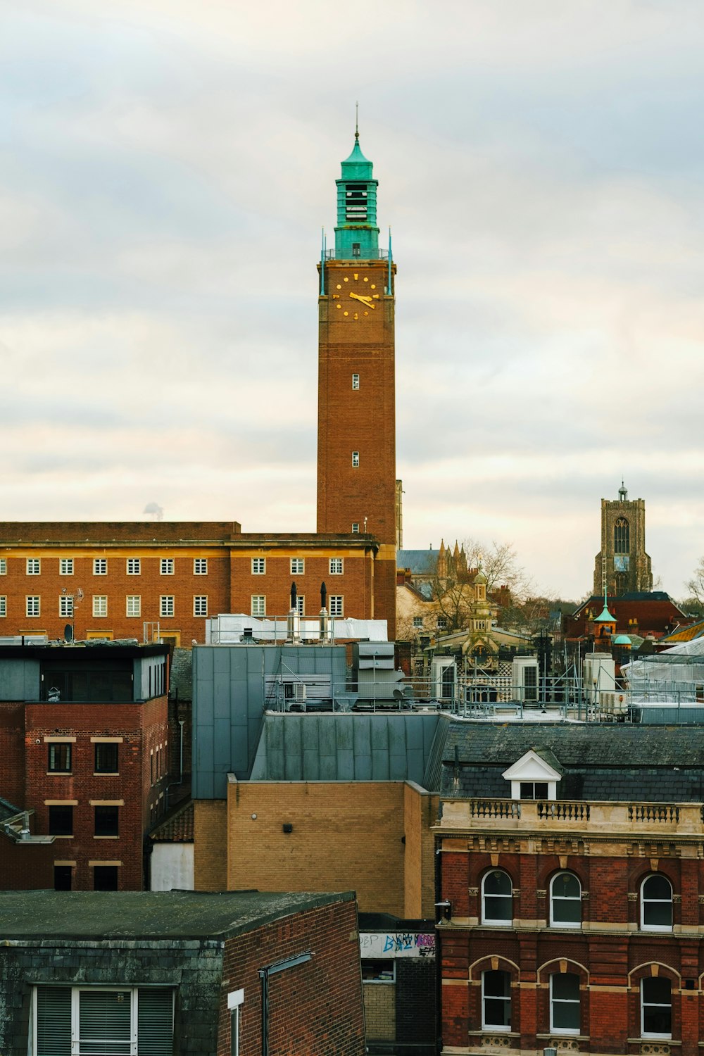 a tall clock tower towering over a city