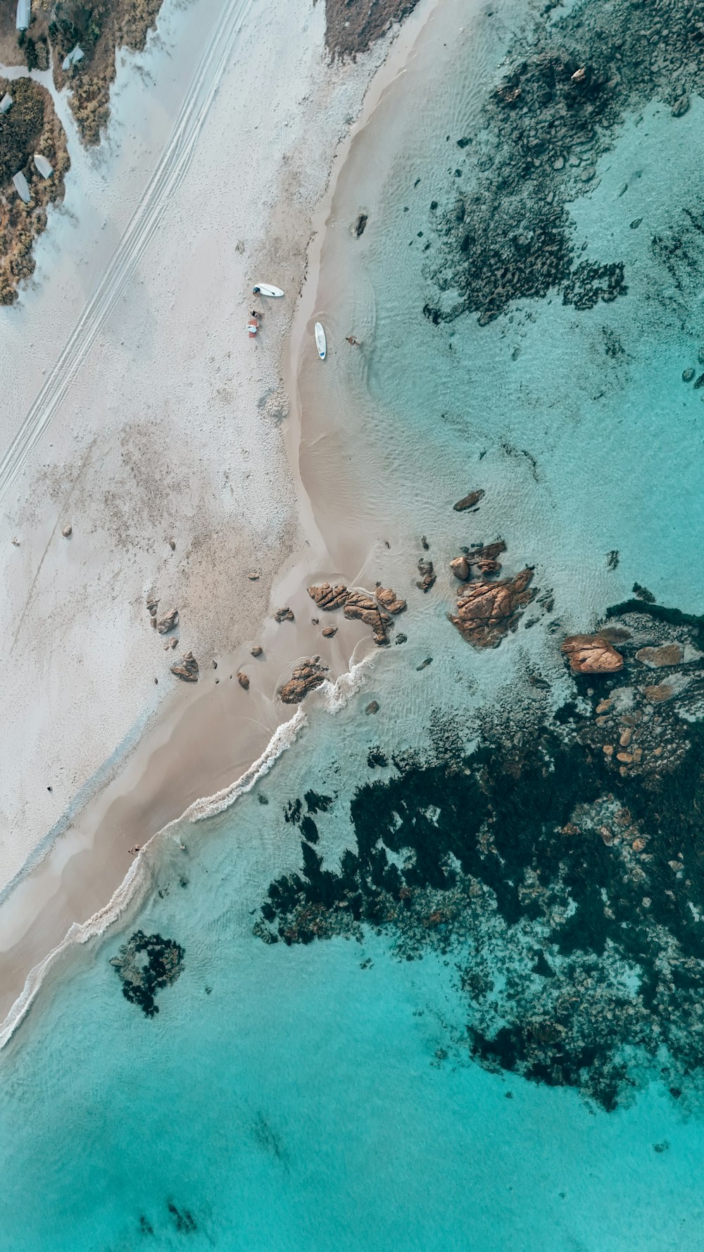 an aerial view of a beach and ocean