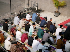 a group of people sitting on the ground