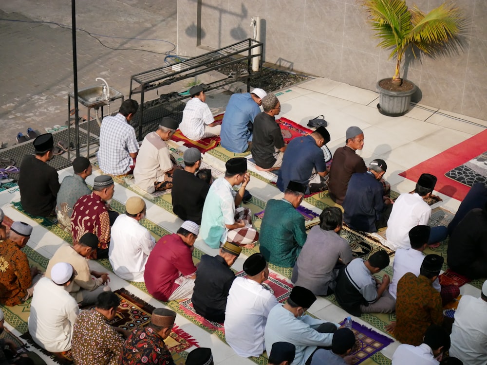 a group of people sitting on the ground