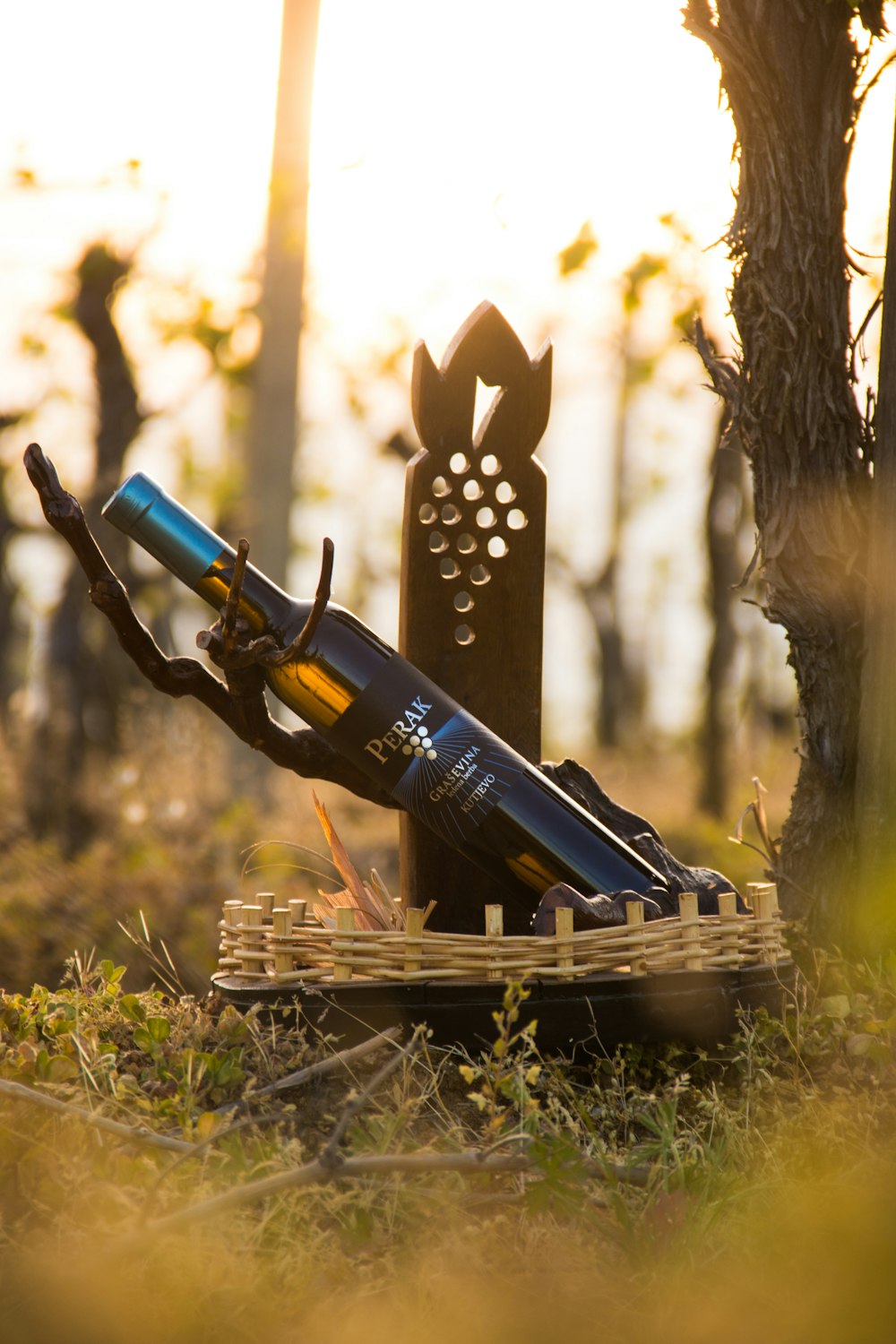 a bottle of wine sitting on top of a wooden crate