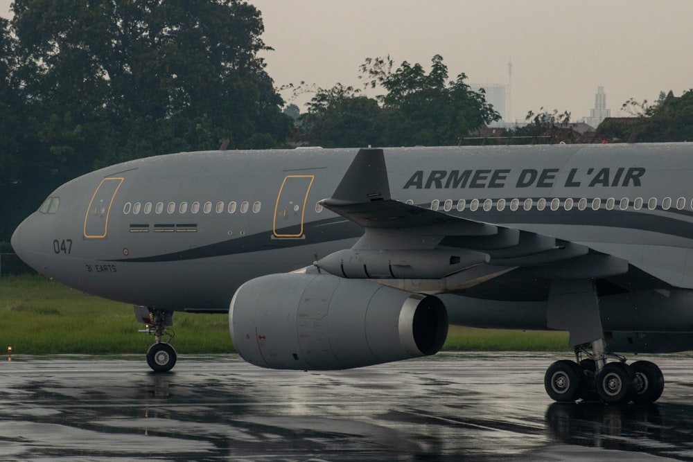 a large jetliner sitting on top of an airport runway