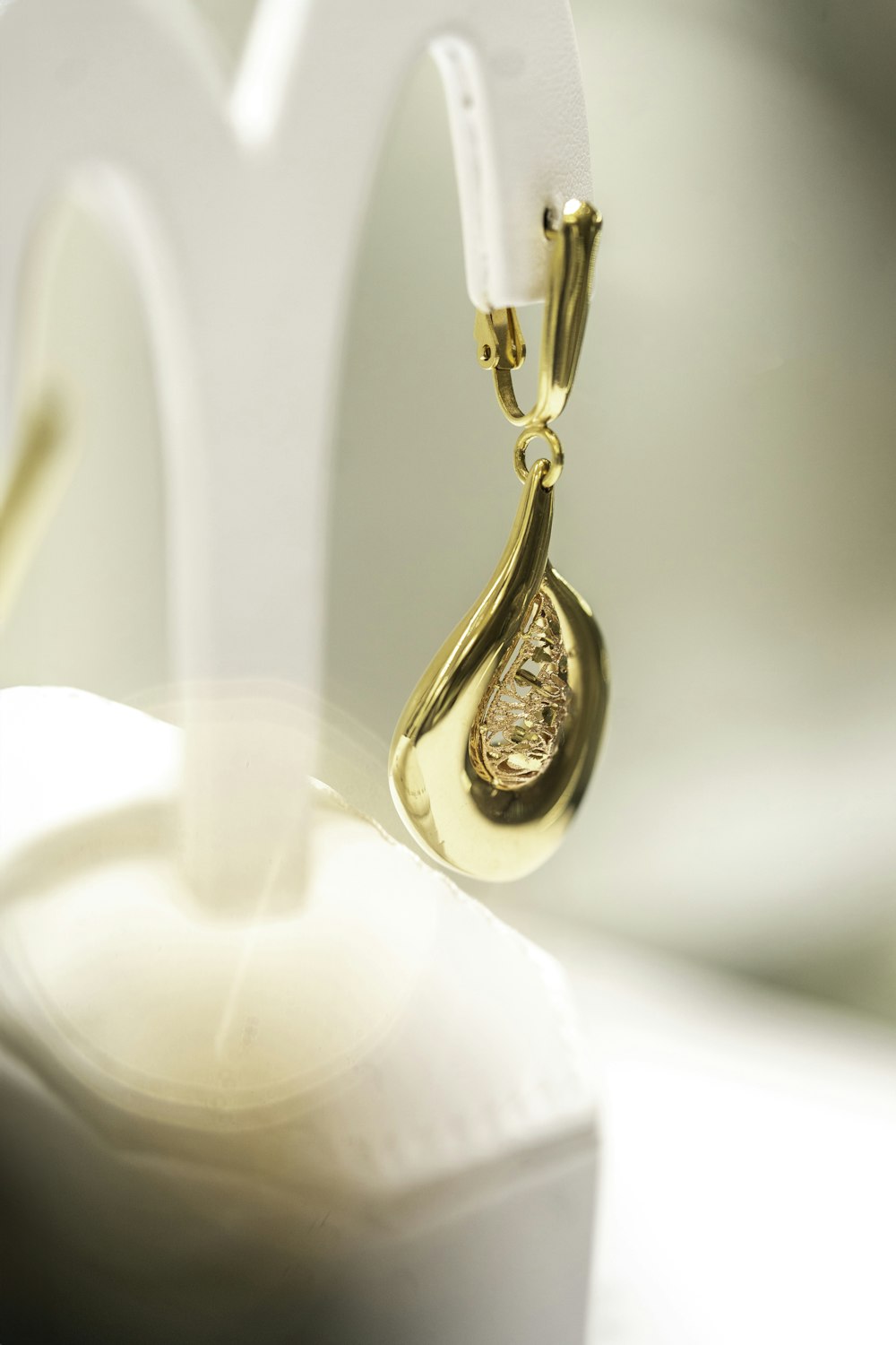a close up of a pair of gold earrings