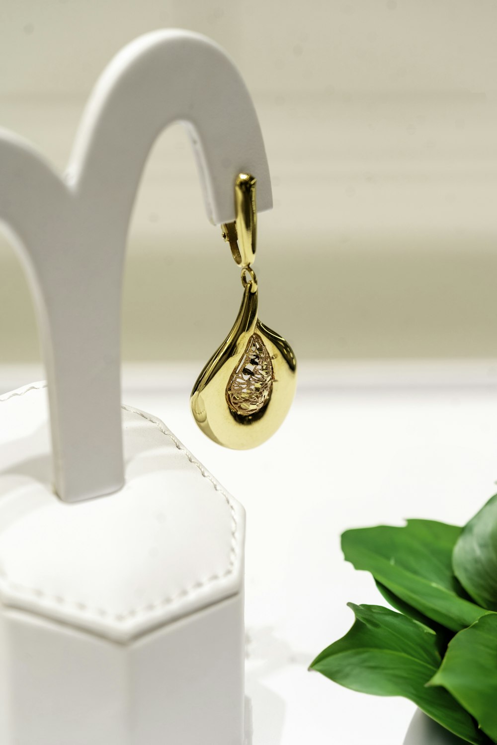 a pair of earrings sitting on top of a table