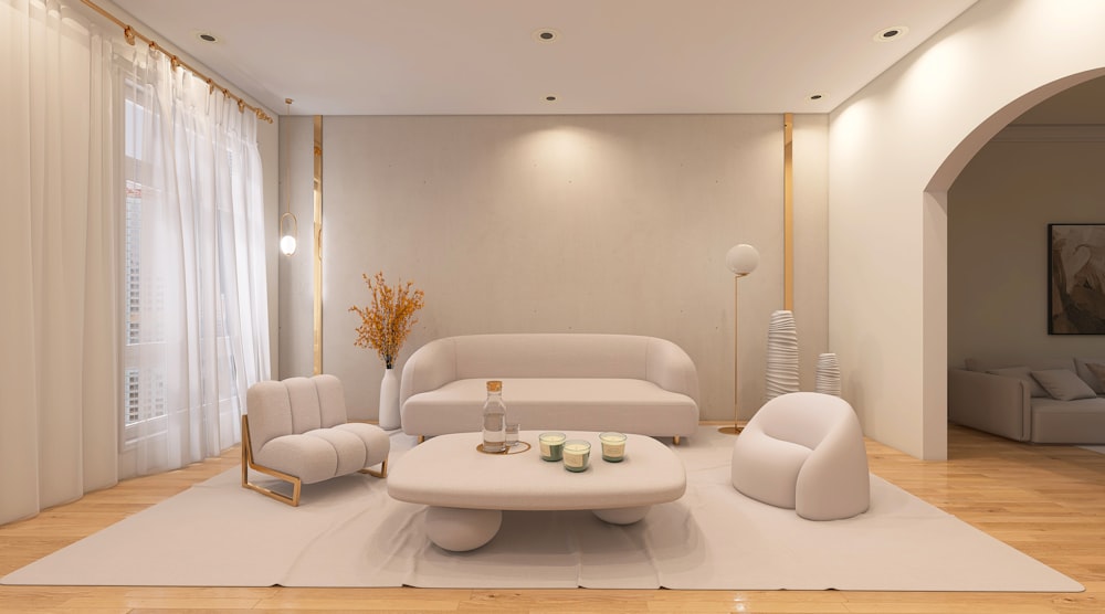 a living room with a white couch and chairs