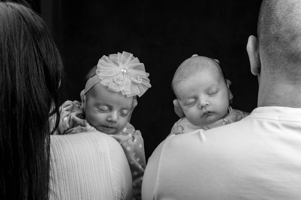 a black and white photo of a baby sleeping