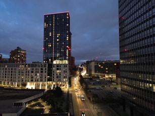 a view of a city at night from the top of a building