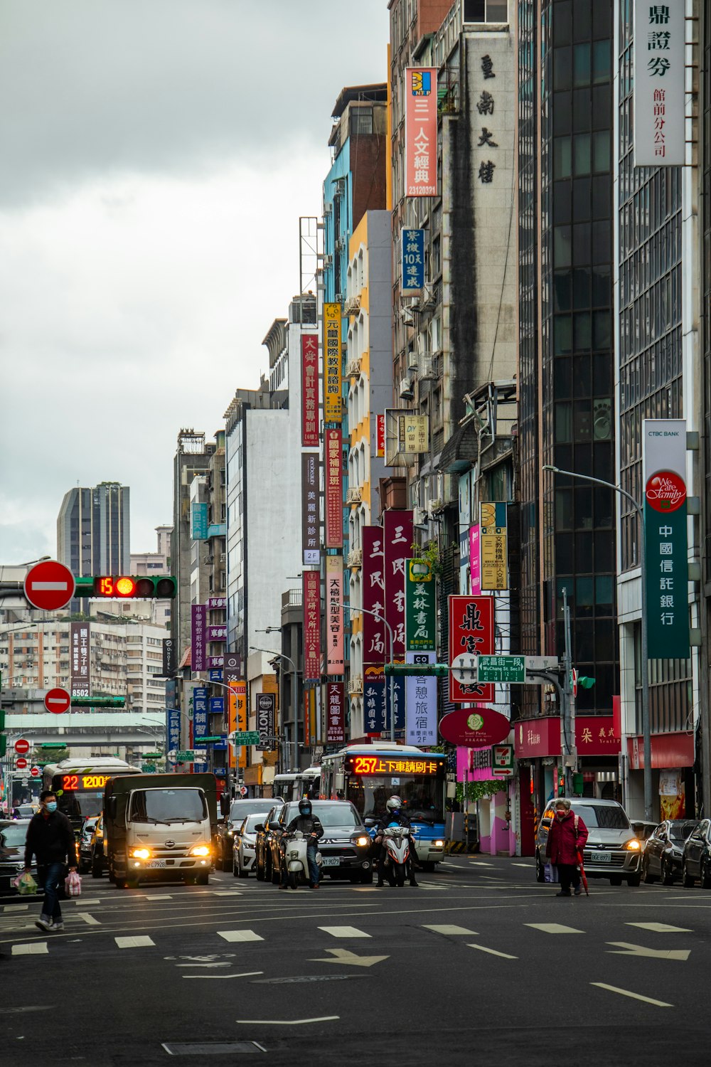 a city street filled with lots of tall buildings