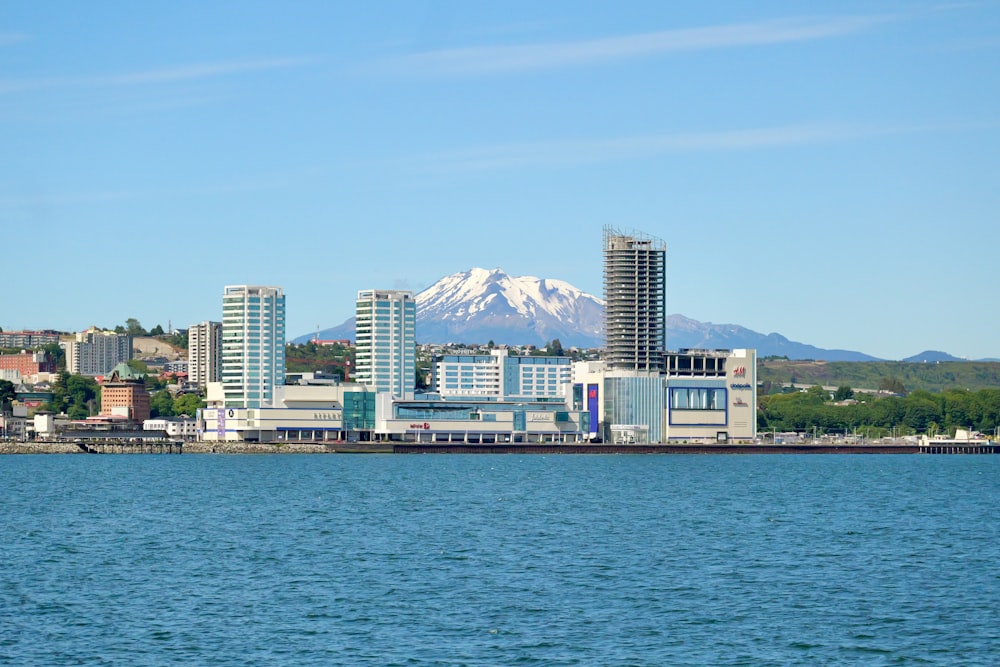 a large body of water with a city in the background