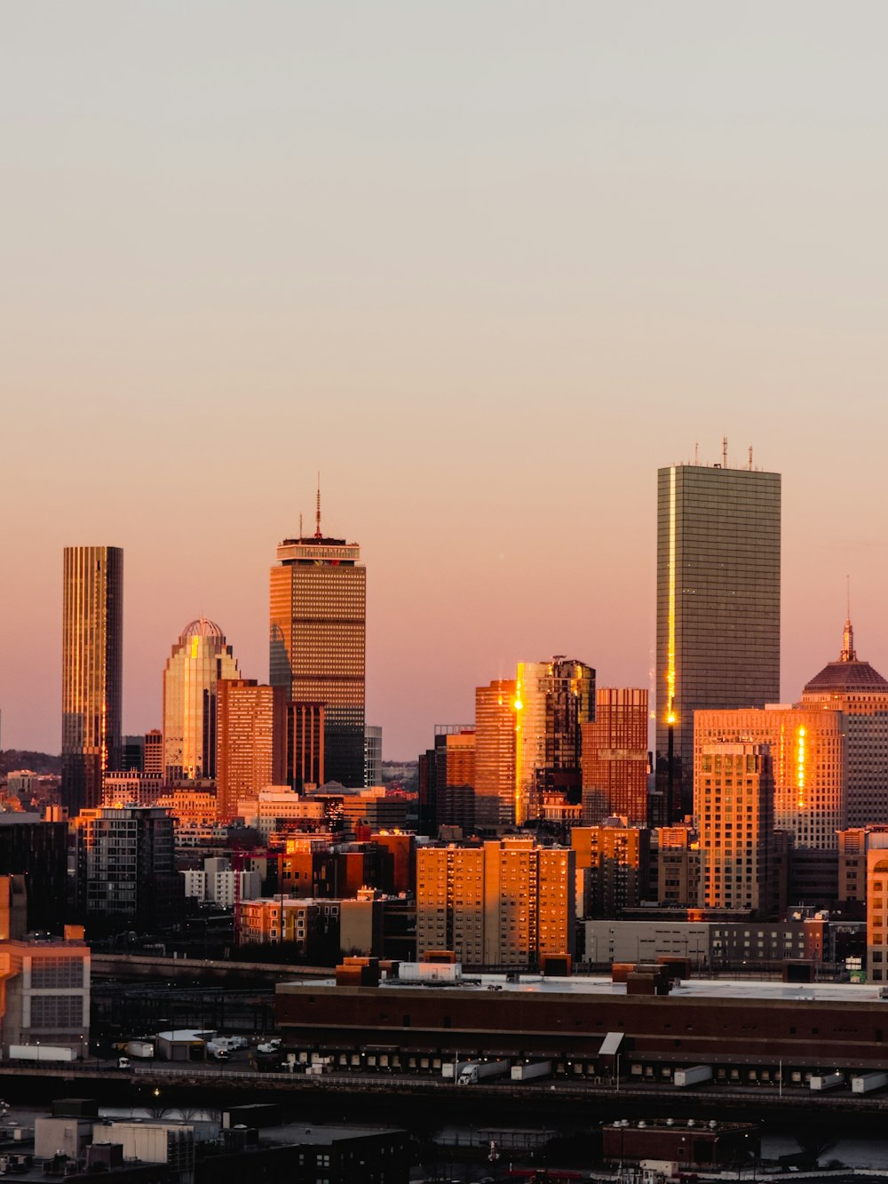 a view of a city skyline at sunset