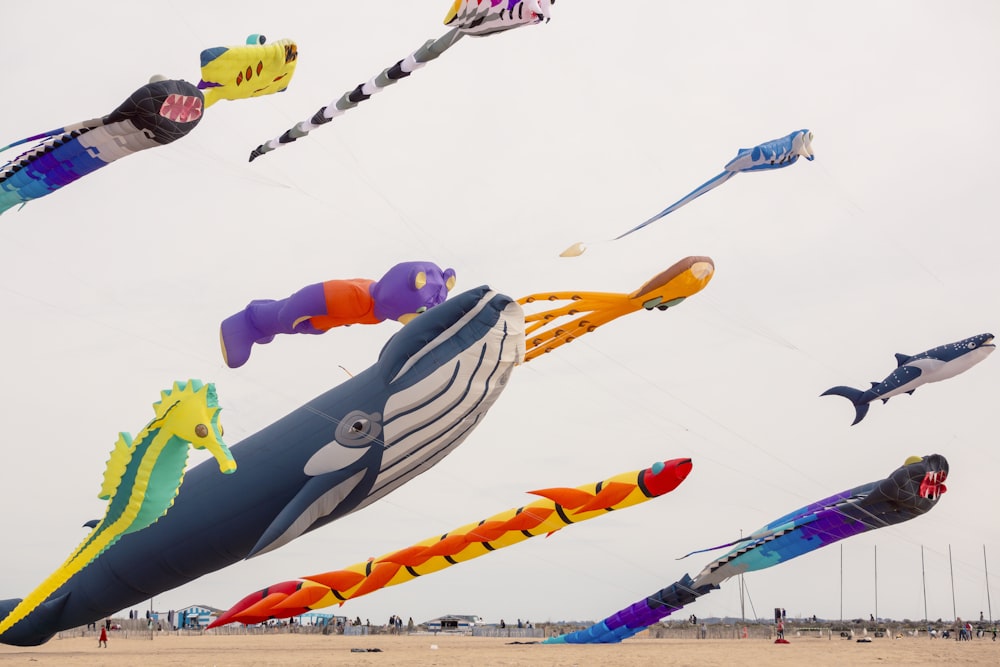 a bunch of kites that are flying in the air