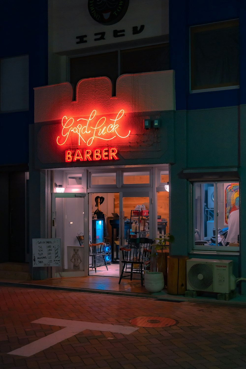 a restaurant with a neon sign on the front of it