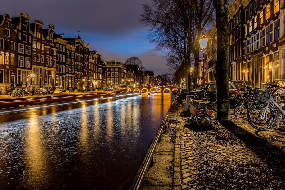 a river running through a city next to tall buildings