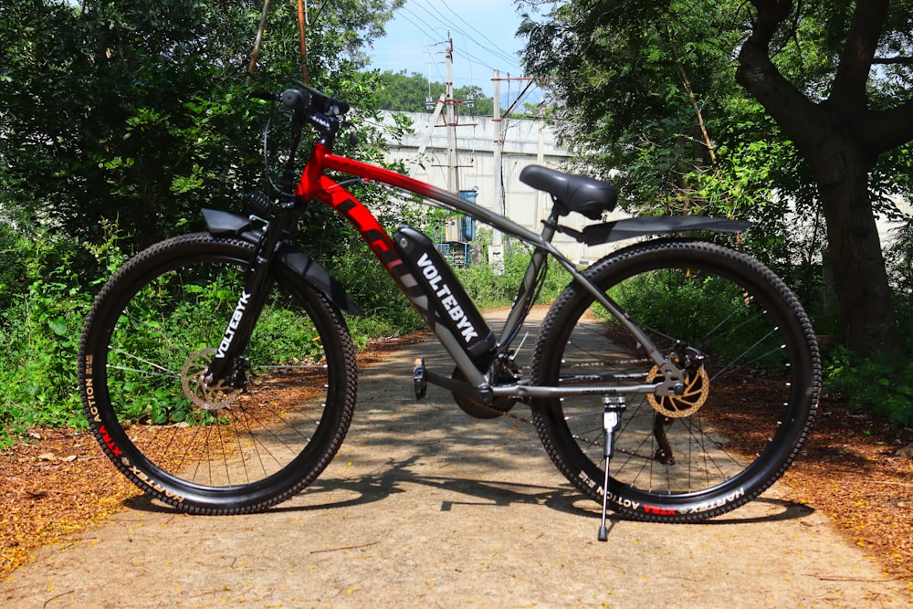 a bike parked on a path in a wooded area