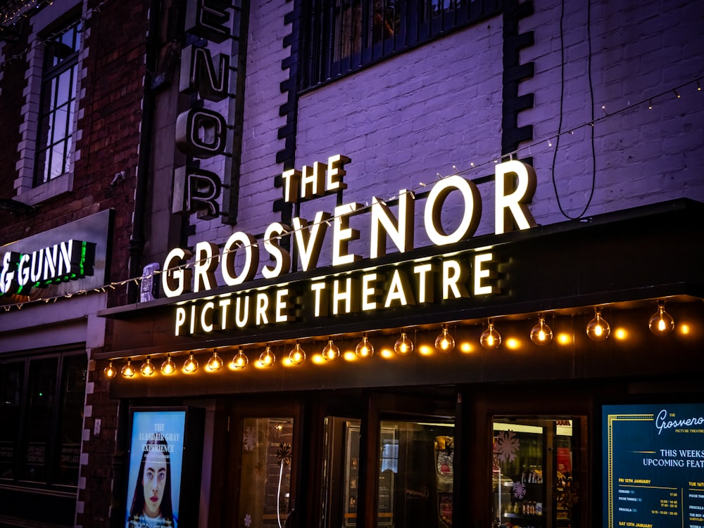 the grosvendor picture theatre is lit up at night