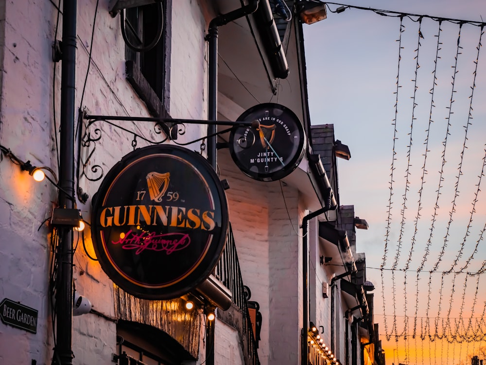 a pub sign hanging from the side of a building