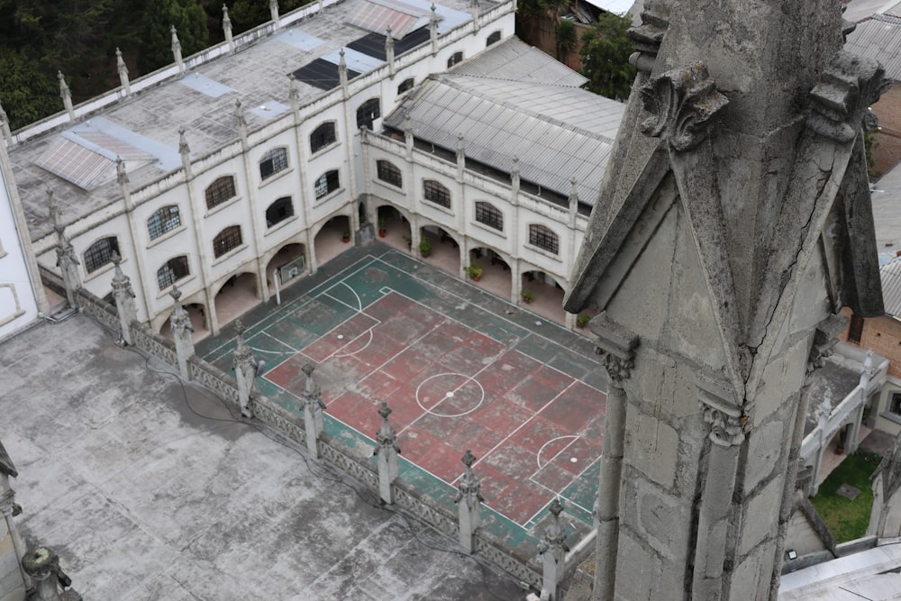 an aerial view of an old building with a basketball court